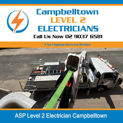 Aerial view of utility truck of level 2 electrician with elevated platform and equipment on pavement in Campbelltown