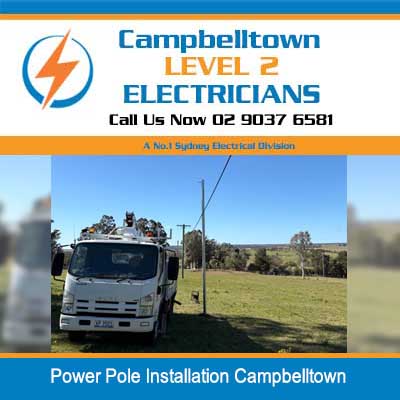 Utility truck parked in open field for power pole installation in Campbelltown